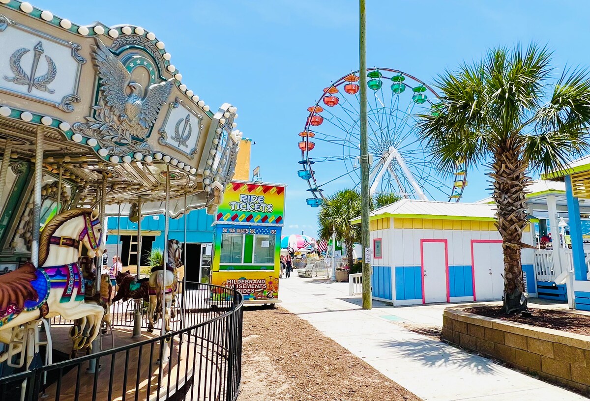 carolina beach boardwalk with carousel and ferris wheel