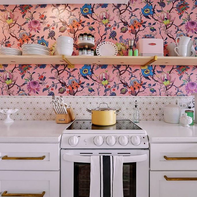 kitchenette with patterned backsplash and floating shelves